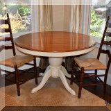 F51. Buying & Design round pedestal dining table with painted base. Leaf stored inside. 60”w 